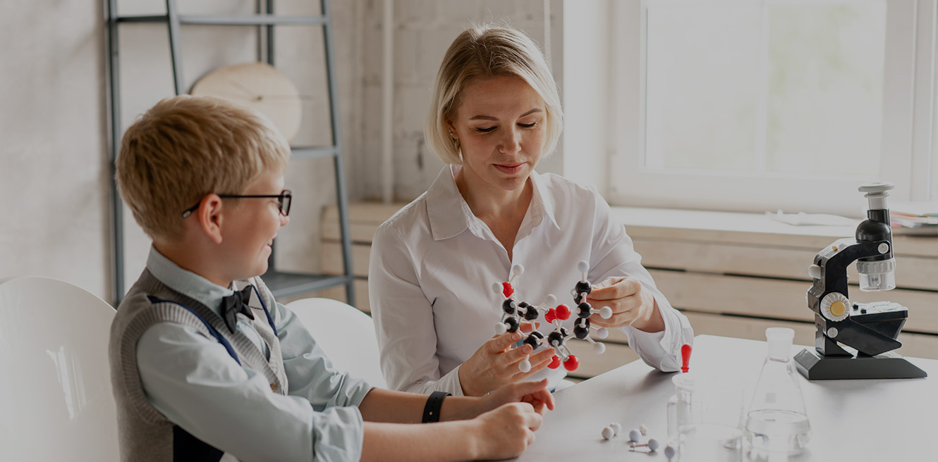 Female science tutor in Santa Barbara studying chemistry with student